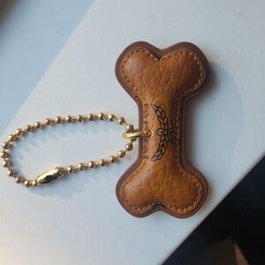 EUC MCM dog bone charm